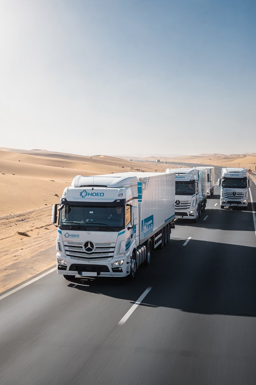 Fleet trucks on a Qatar highway